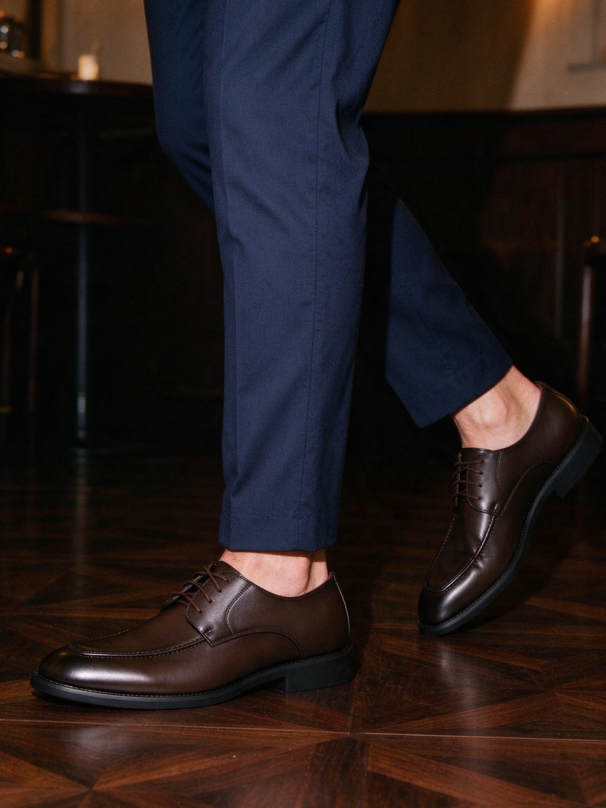 The Wine List Derby in brown on foot, dark parquet bar floor