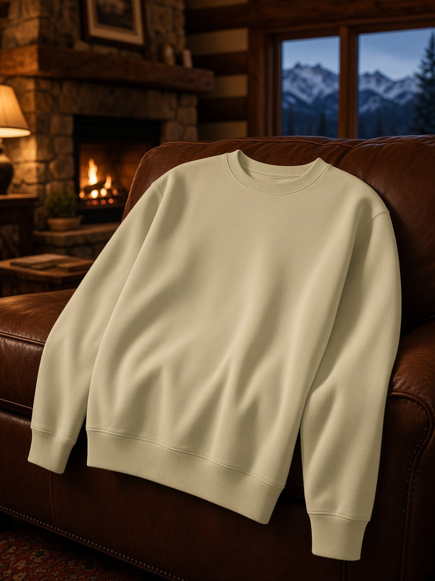 Marcel Afters Classic Cotton Sweatshirt in Khaki, laid flat, living room