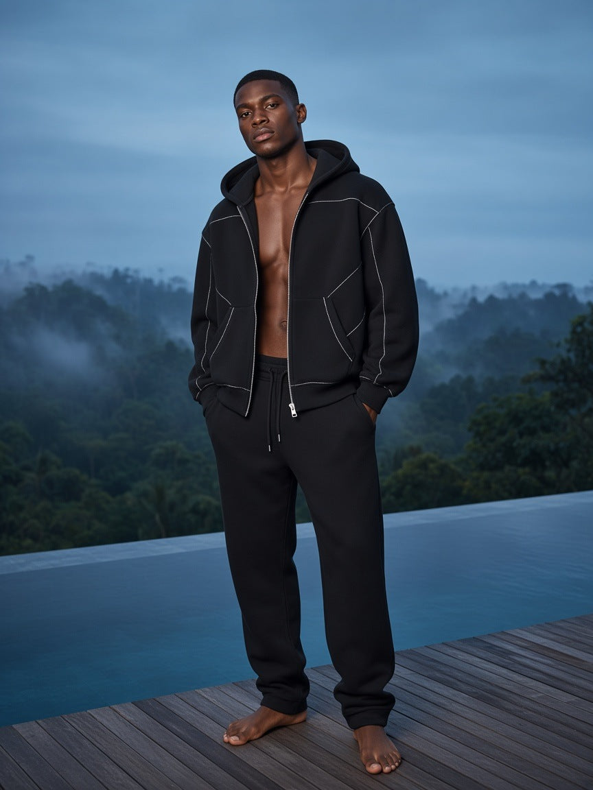 Marcel Afters Contrast-Stitched Boxy Fleece Zip Hoodie in Black, worn by a man, forest
