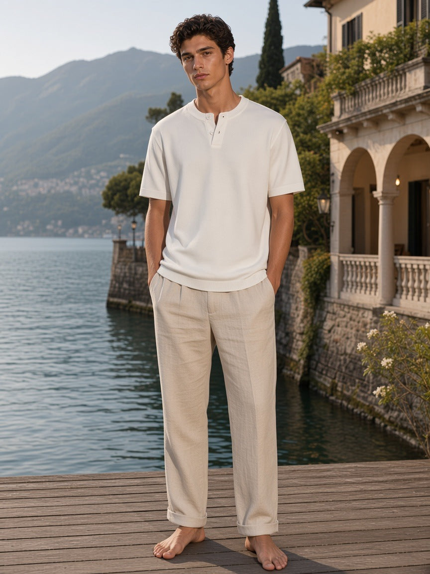 Marcel Afters Cotton Knit Short Sleeve Henley T-Shirt in White, worn by a man, lake