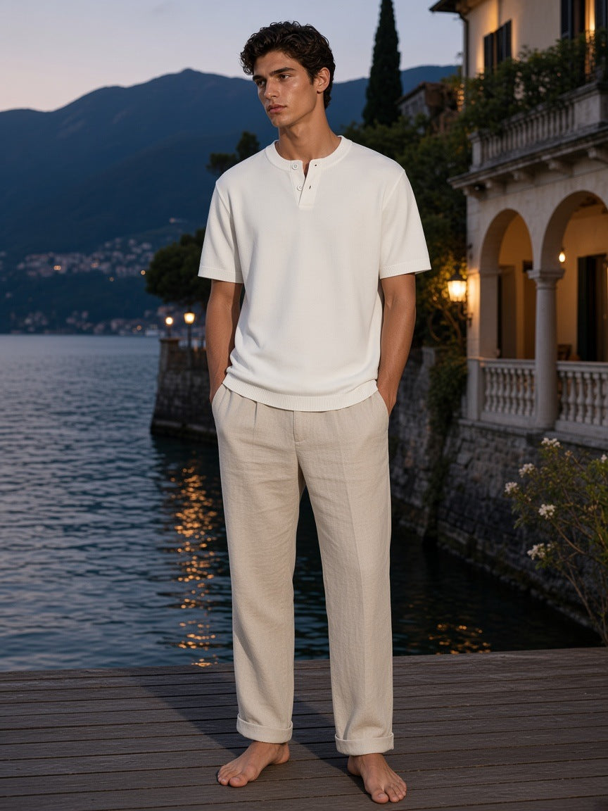 Marcel Afters Cotton Knit Short Sleeve Henley T-Shirt in White, worn by a man, on a dock