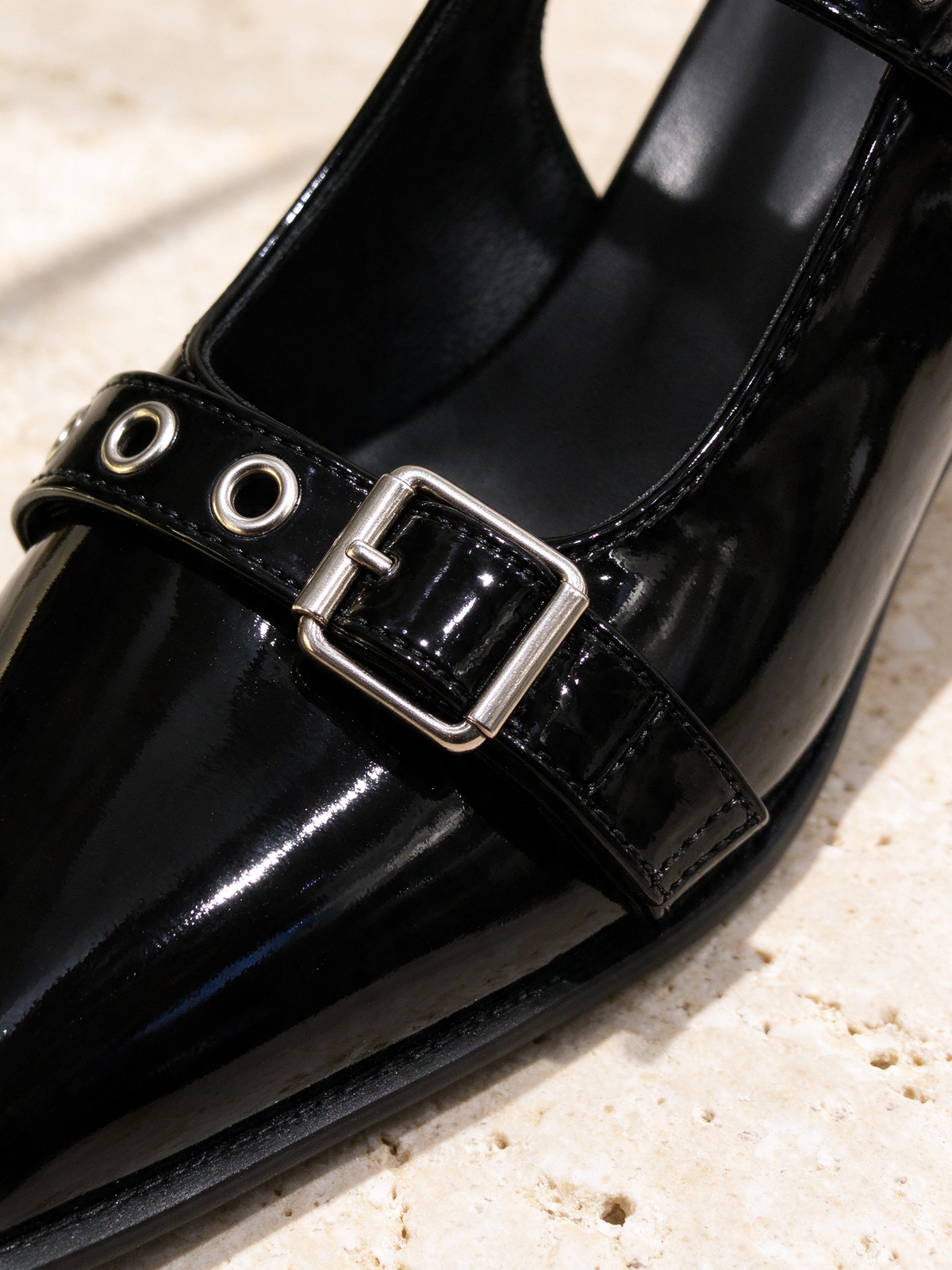 The Do Not Disturb Slingback in black, detail shot: leather, stitching, sole or hardware