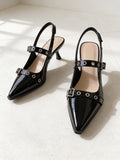 The Do Not Disturb Slingback in Black, pair on pale limestone