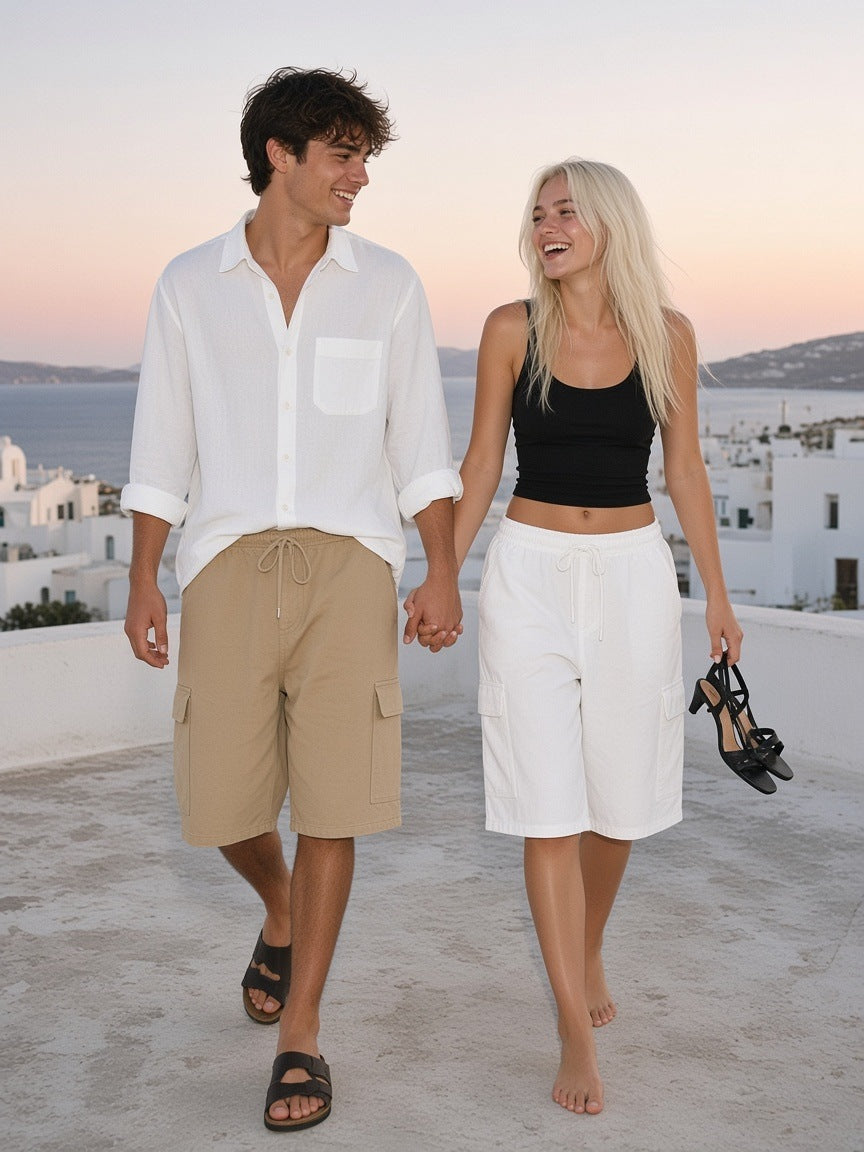 Marcel Afters Drawstring Cargo Shorts in White, worn by a woman, rooftop