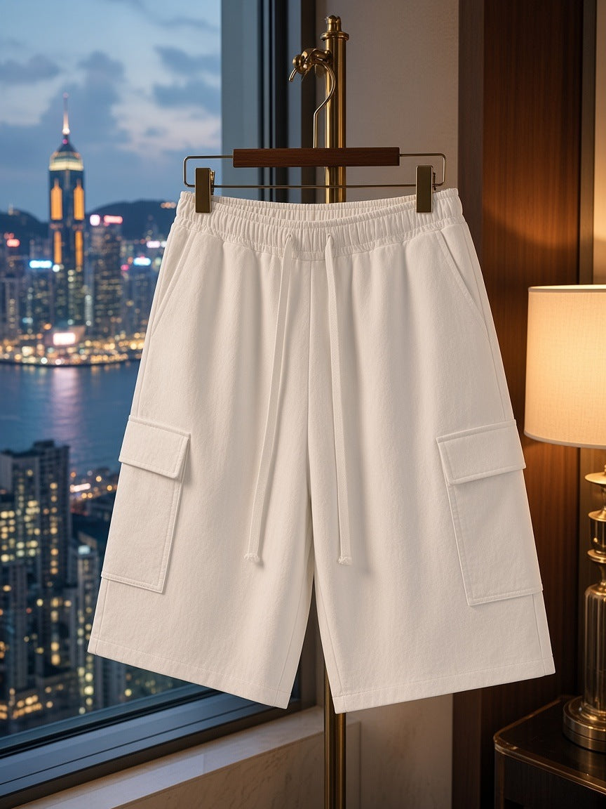 Marcel Afters Drawstring Cargo Shorts in White, on a hanger, hotel room