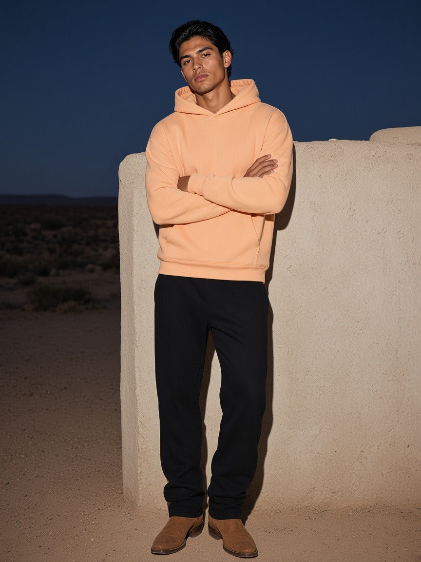 Model wearing the Drop Shoulder Hoodie in Apricot, full-length model photo