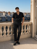 Model wearing the Drop Shoulder Short-Sleeve Polo in Black, full-length model photo