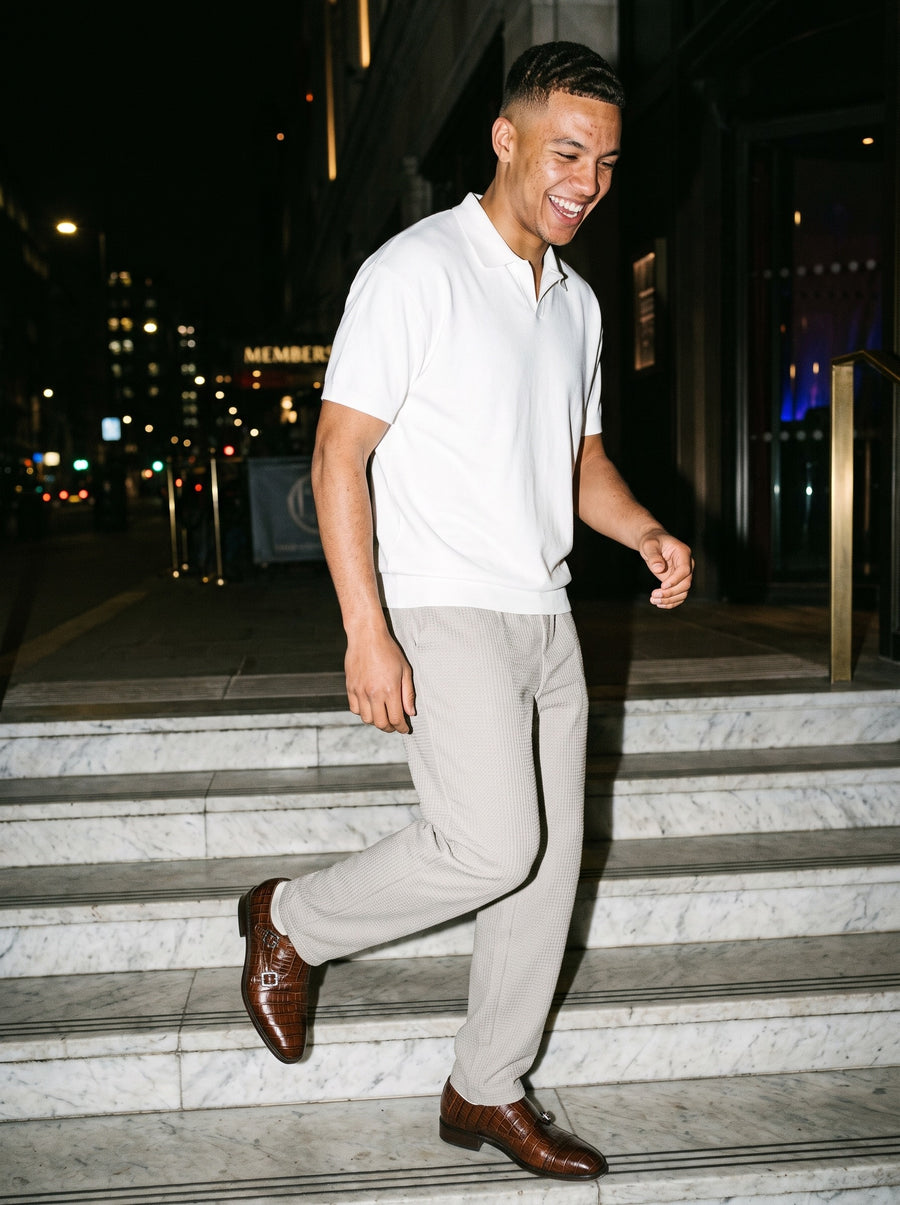 Friends together, one wearing the Marcel Afters Drop Shoulder Short-Sleeve Polo, Light Tones in White