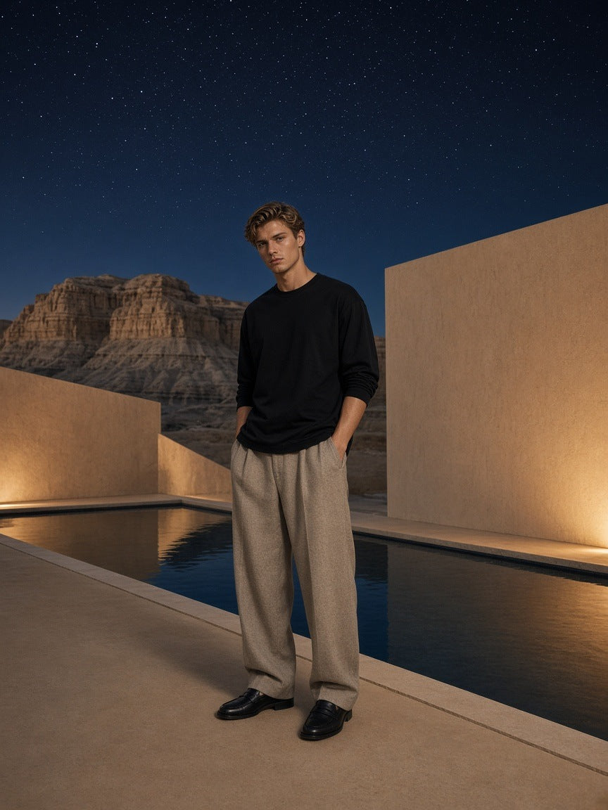 Marcel Afters Essential Cotton Long Sleeve T-Shirt in Black, worn by a man, desert