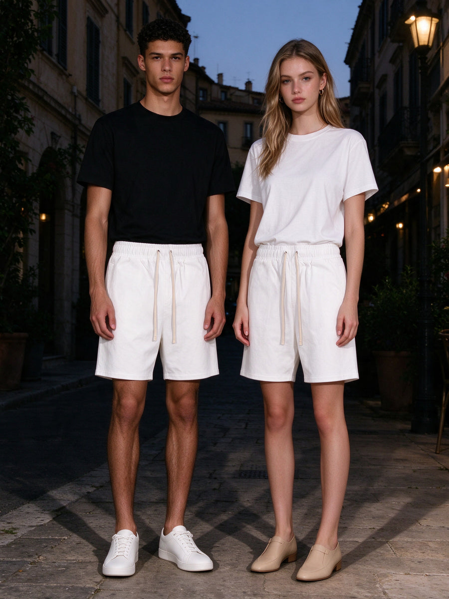 Two people wearing the Essential Cotton Shorts in White, full-length model photo