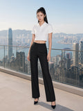 Woman wearing the Essential Cropped Polo Shirt in White, full-length model photo