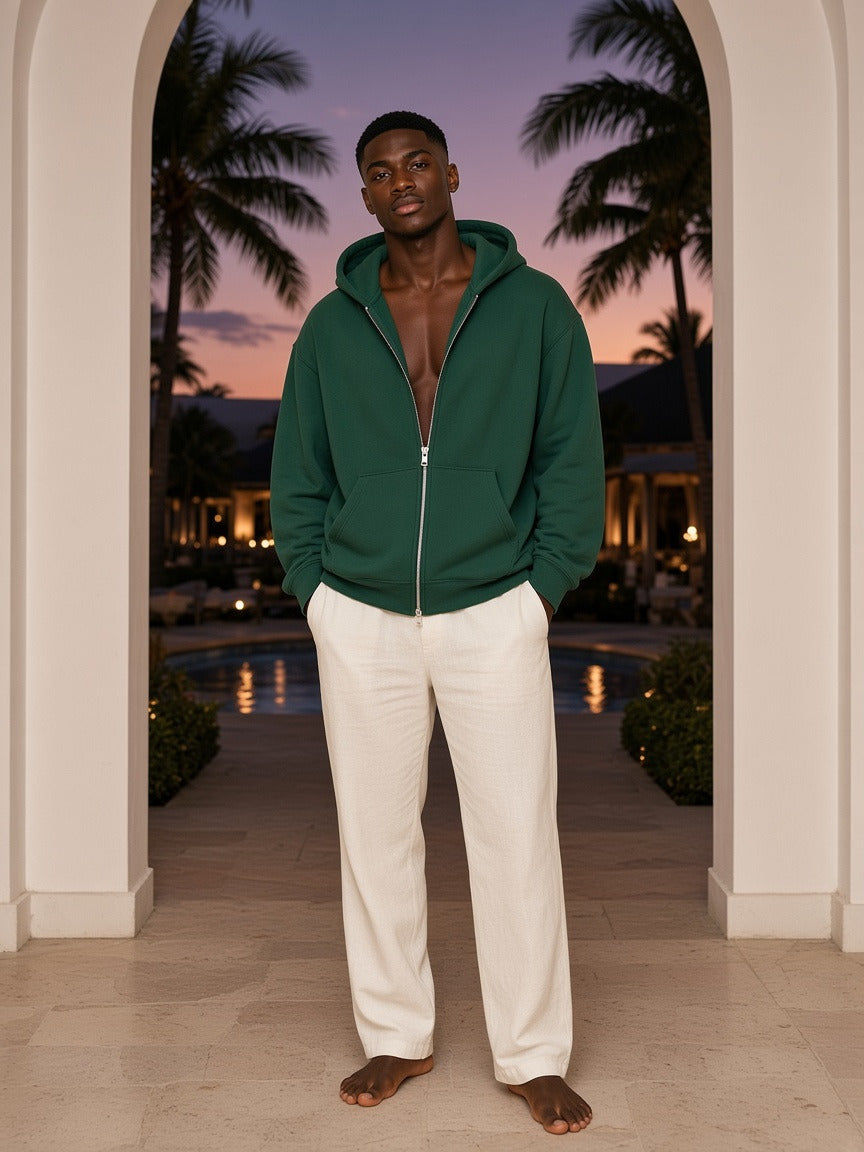 Model wearing the Essential Fleece Zip-Through Hoodie in Eden Green, full-length model photo