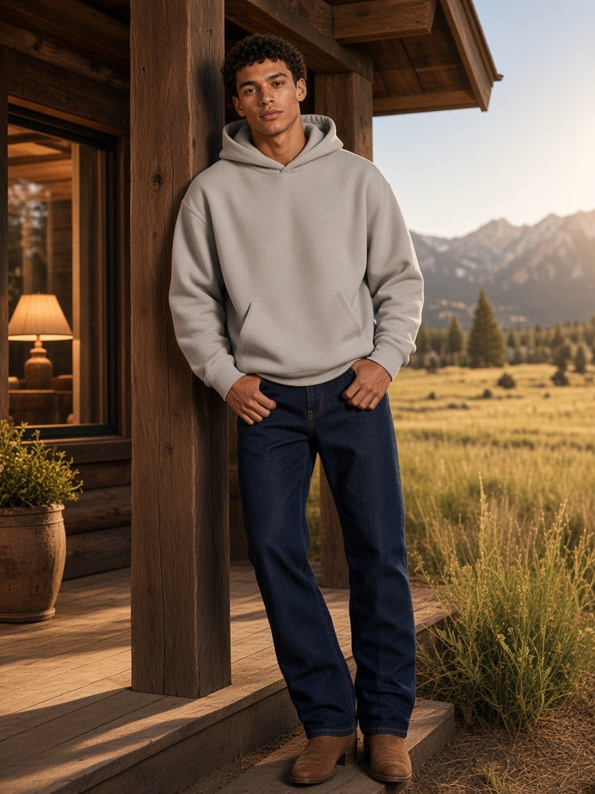 Marcel Afters Essential Heavyweight Boxy Fleece Hoodie in Oat Gray, worn by a man, cabin