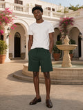 Man wearing the Essential Heavyweight Cotton Shorts in Dark Green, full-length model photo