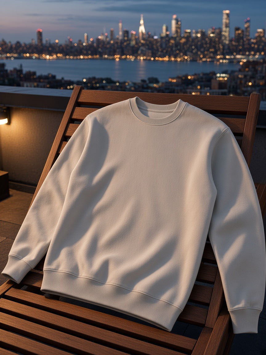 Marcel Afters Essential Heavyweight Crewneck Sweatshirt, 400 gsm in Camel, laid flat, city rooftop at dusk