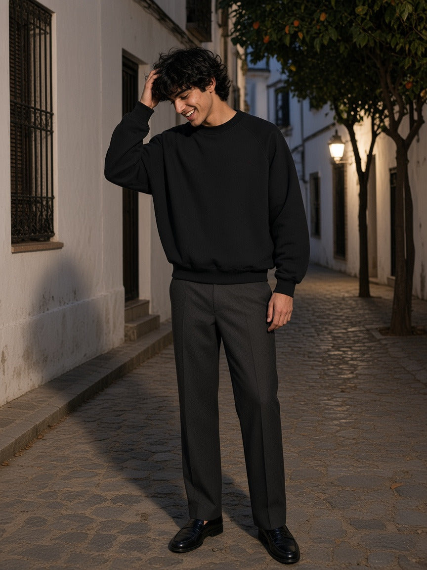 Man wearing the Essential Heavyweight Dolman Sleeve Boxy Sweatshirt in Black, full-length model photo