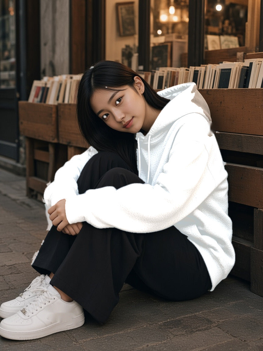 Model wearing the Essential Heavyweight Drop-Shoulder Hoodie in White, full-length model photo