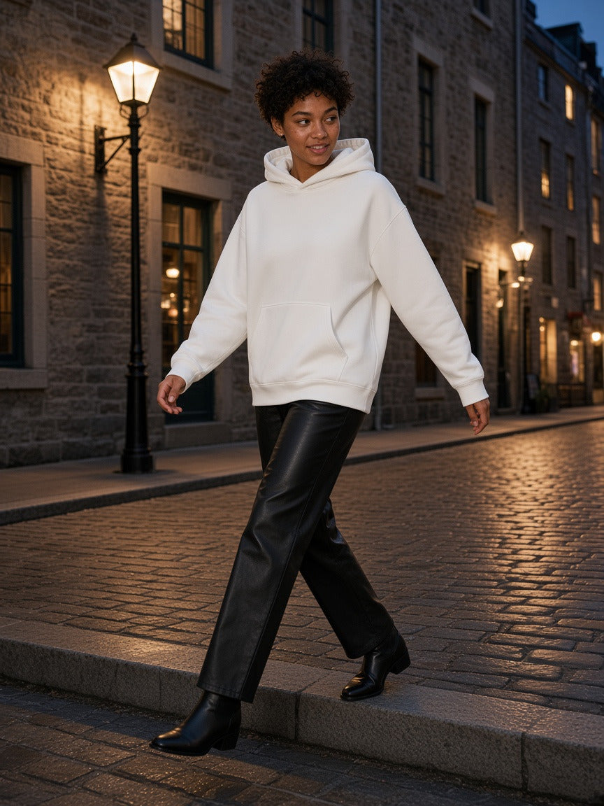 Woman wearing the Essential Heavyweight Drop-Shoulder Hoodie in White, full-length model photo