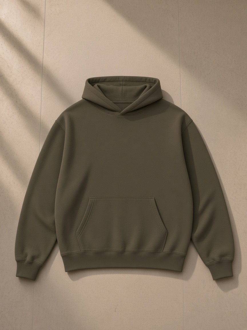 Unisex heavyweight fleece hoodie in Olive Green, laid flat on pale limestone, front view
