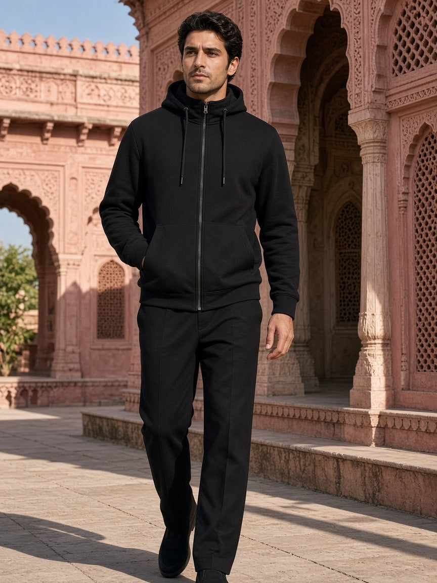 Marcel Afters Essential Heavyweight High Neck Zip-Up Hoodie in Black, worn by a man, outdoors
