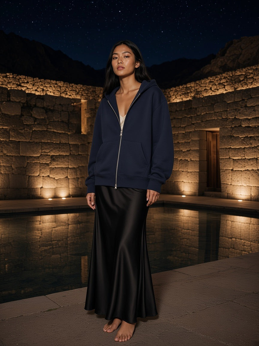 Marcel Afters Essential Heavyweight Pocket Hoodie in Navy Blue, worn by a woman, outdoor at night