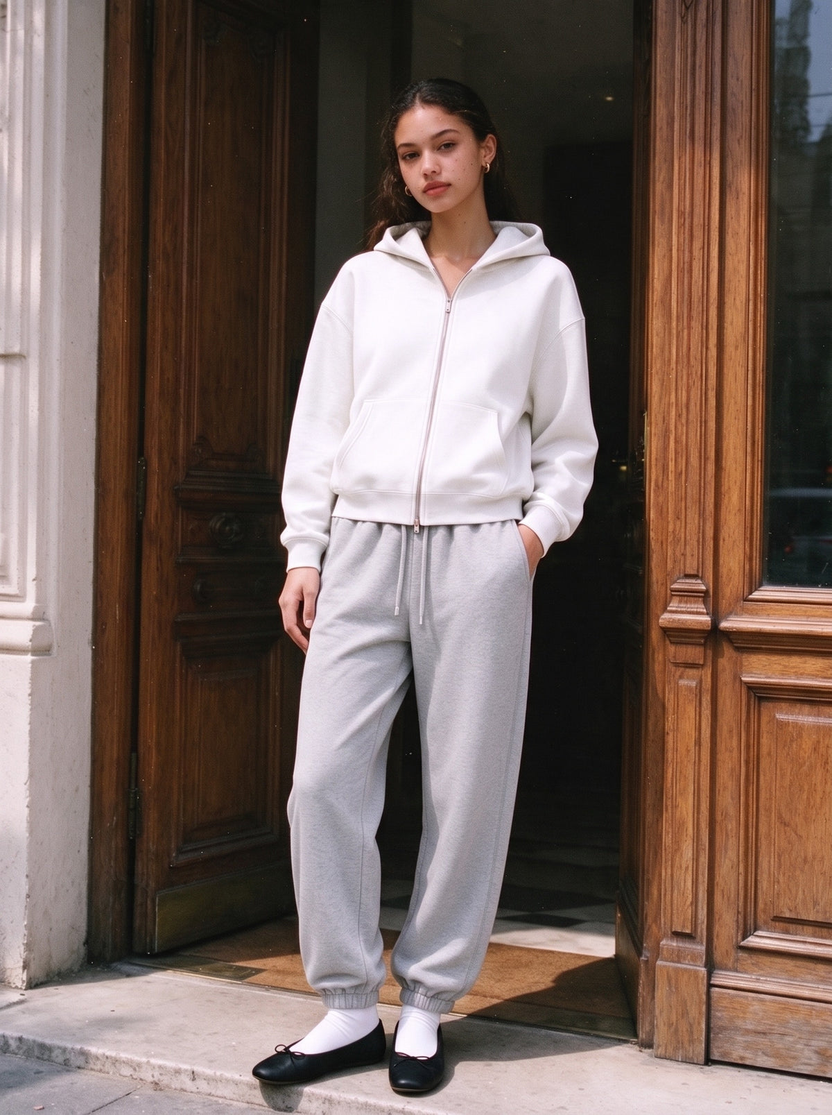 Woman wearing the Essential Jogged Sweatpants in Flower Gray, full-length model photo