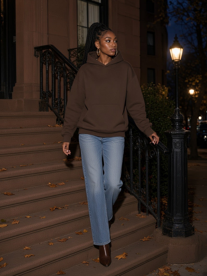 Marcel Afters Essential Oversized Boxy Fit Fleece Hoodie in coffee brown, worn with jeans on brownstone steps at night