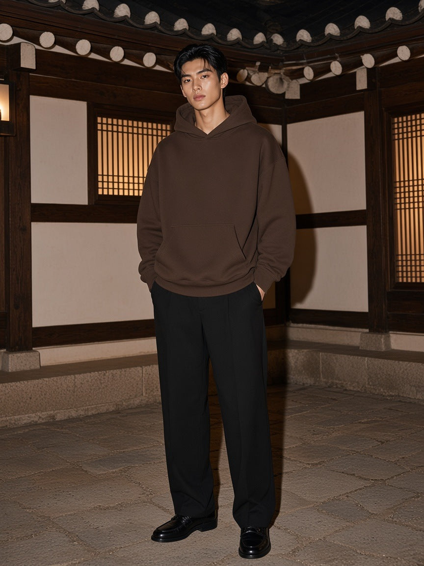 Marcel Afters Essential Oversized Boxy Fit Fleece Hoodie in Coffee, worn by a man, traditional japanese building