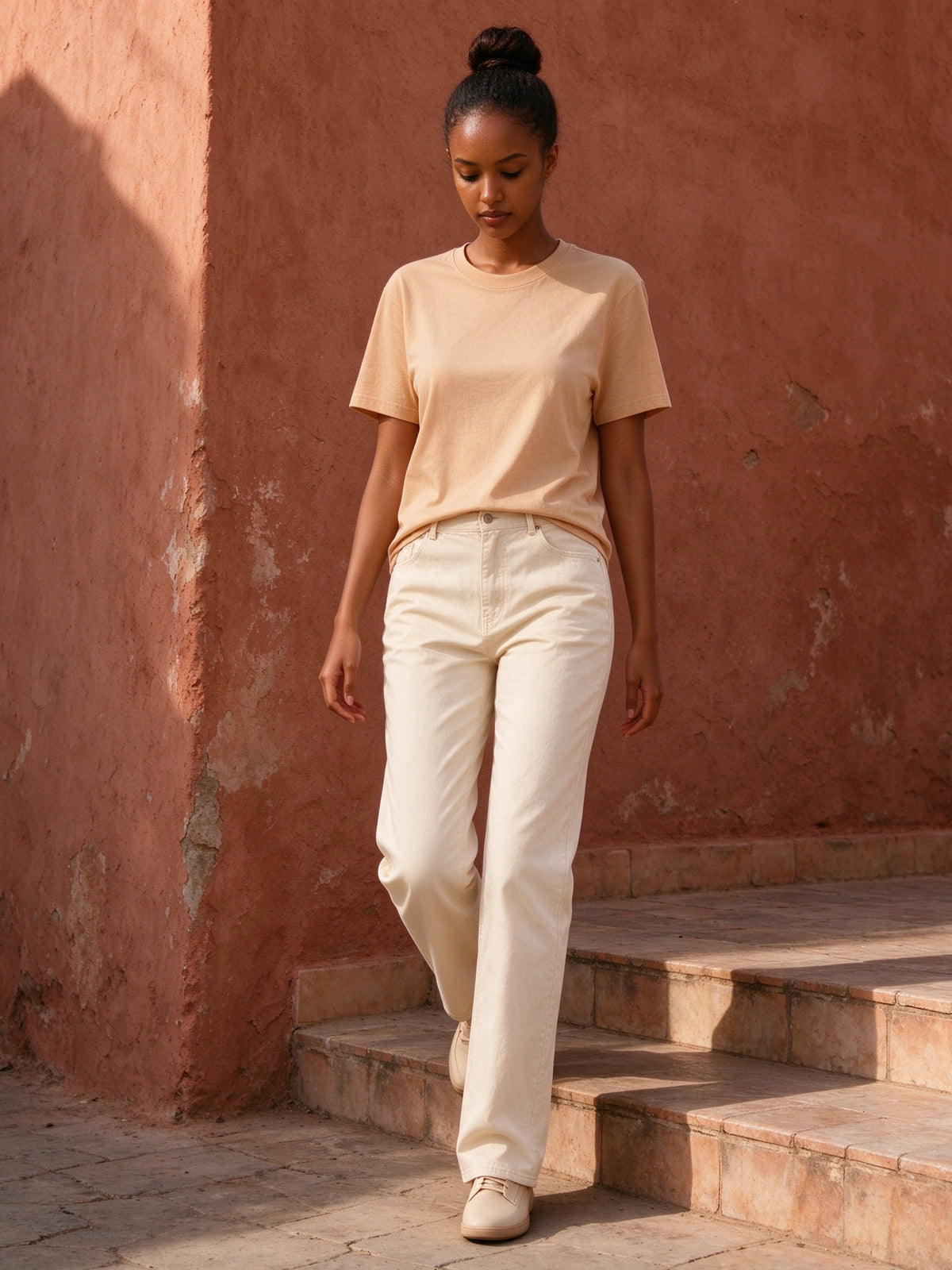 Woman wearing the Essential Standard Shoulder T-Shirt in Mild Apricot, full-length model photo