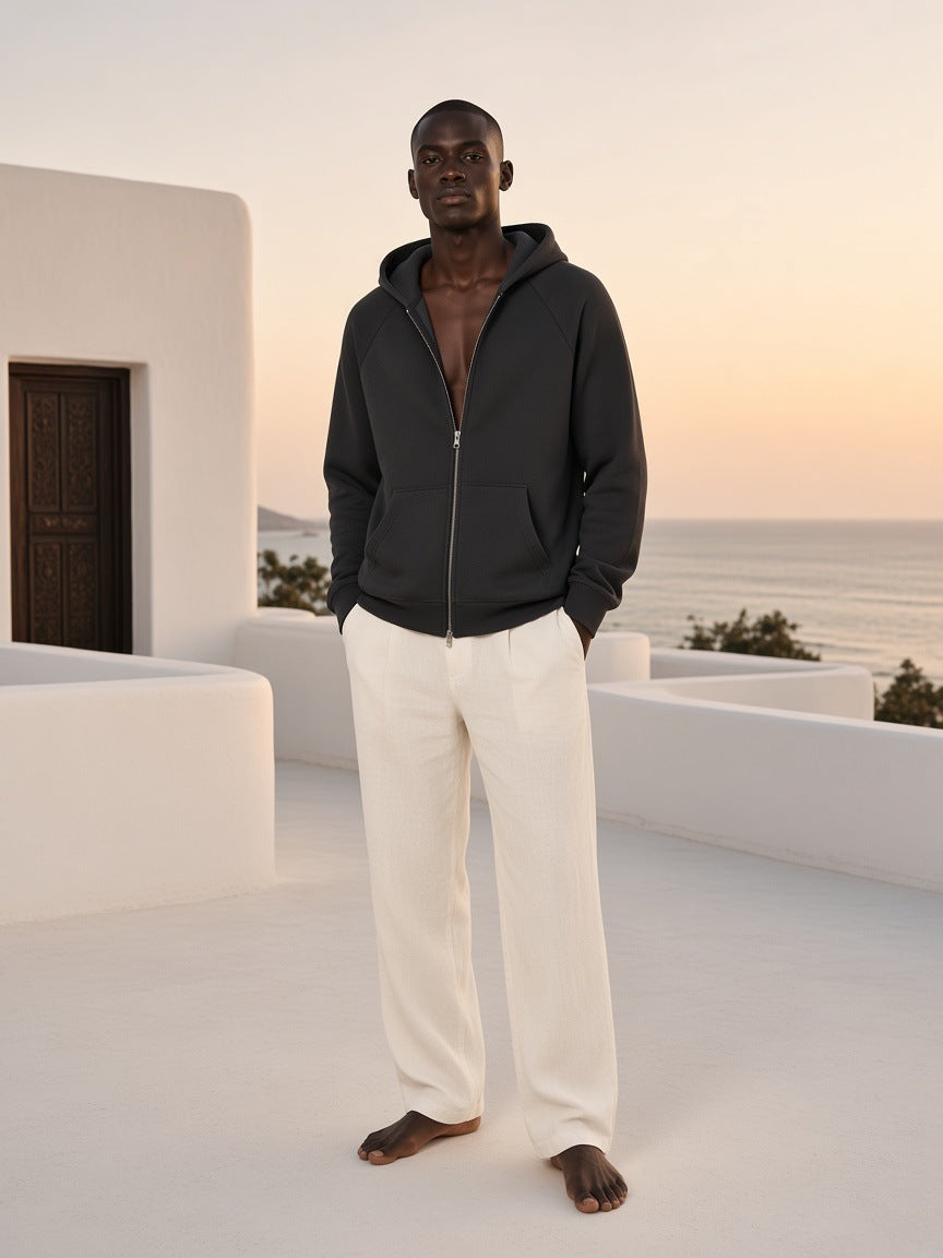 Marcel Afters Essential Zip-up Fleece Hoodie in Cement Gray, worn by a man, beach