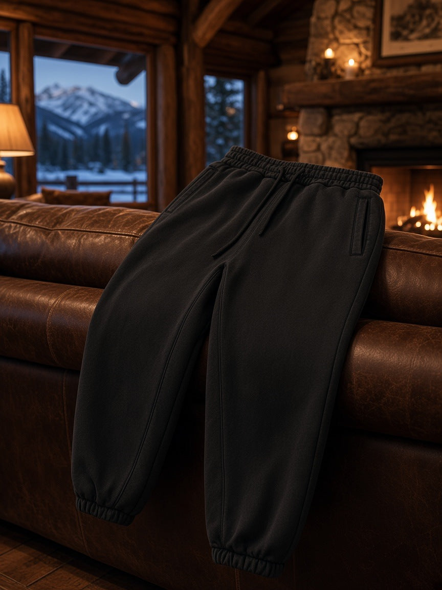 Marcel Afters Fleeced Jogger Sweatpants in Dark Green, laid flat, living room
