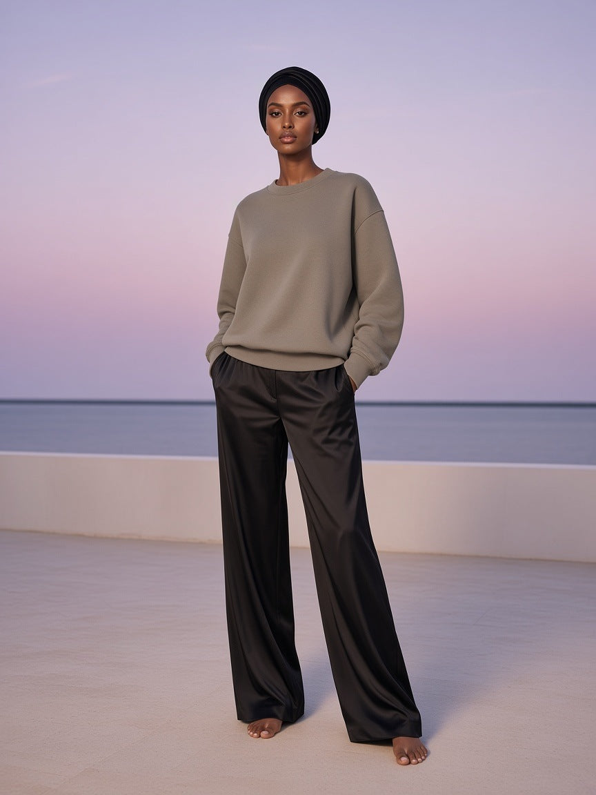 Marcel Afters Fleeced Sweatshirt in Gray, worn by a woman, beach