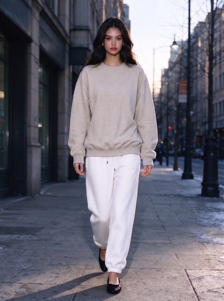 Model wearing the Fleeced Sweatshirt in Oat Gray, full-length model photo