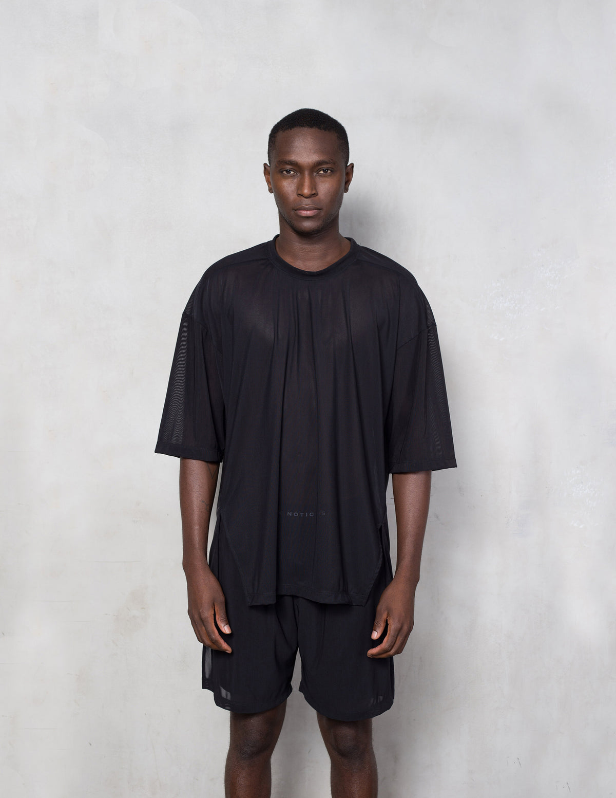 True Notions Flex Mesh Oversized Tee — Black in black, worn on-model