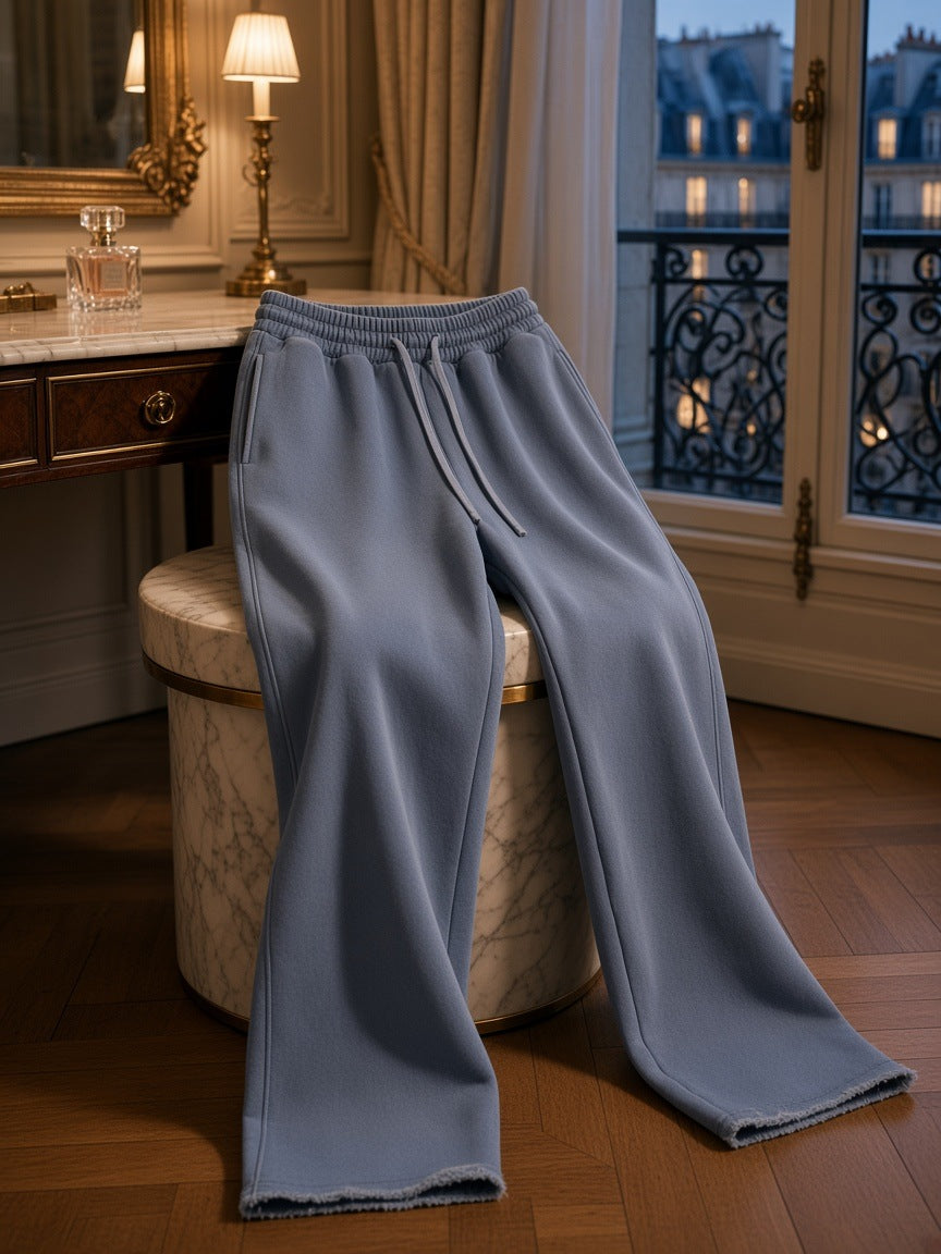 Marcel Afters Frayed Enzyme Washed Fleece Sweatpants in Blue, worn by a woman, in a room