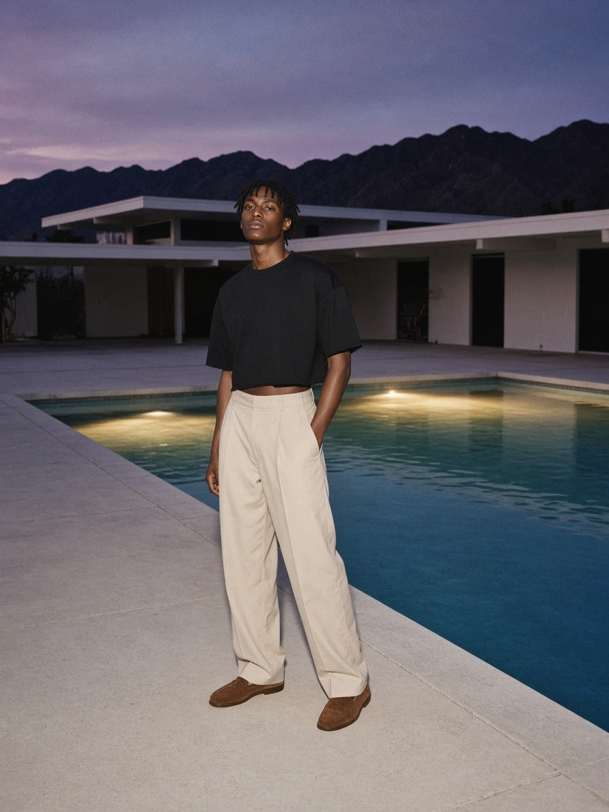 Marcel Afters French Terry Raw Edge T-Shirt in Black, worn by a man, poolside