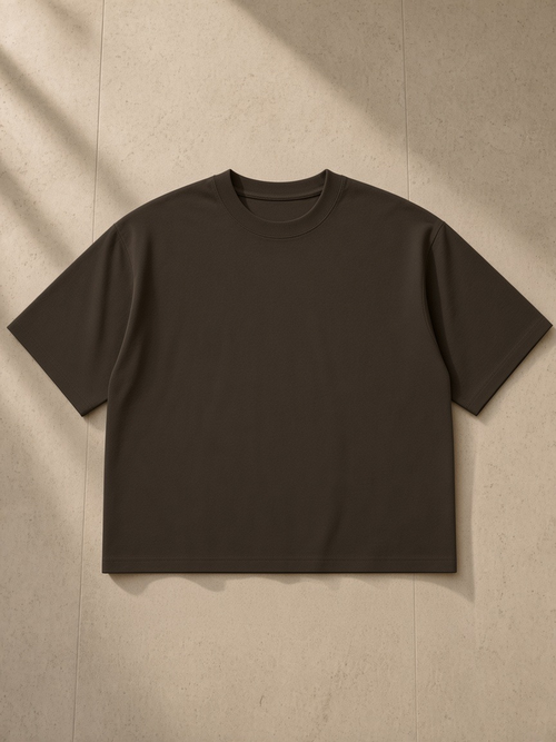 Heavyweight Boxy T-Shirt in Coffee, laid flat on pale limestone