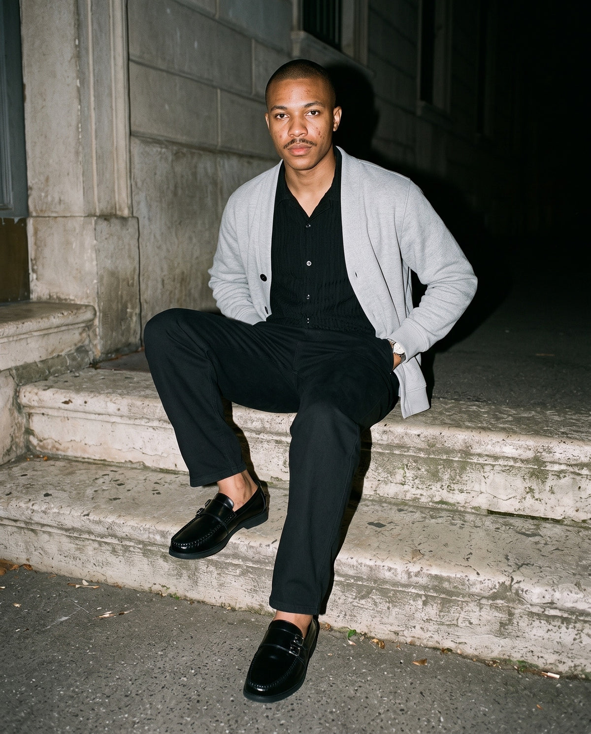 Friends together, one wearing the Marcel Afters Heavyweight Cotton Straight-Leg Pants, Dark Tones in Black