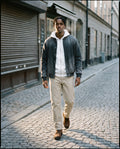Man wearing the Heavyweight Cotton Straight-Leg Pants in Pale Khaki, full-length model photo