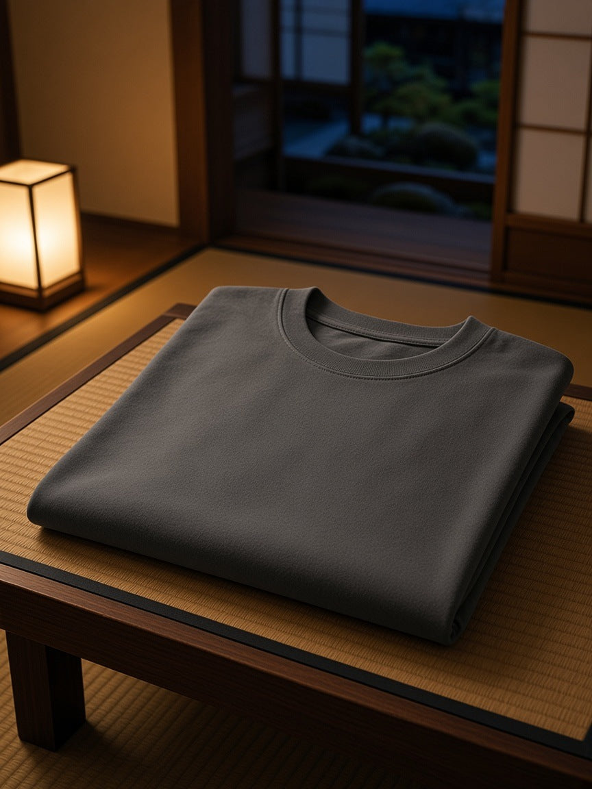 Marcel Afters Heavyweight Drop Shoulder Cotton T-Shirt in Dark Gray, laid flat, traditional japanese room