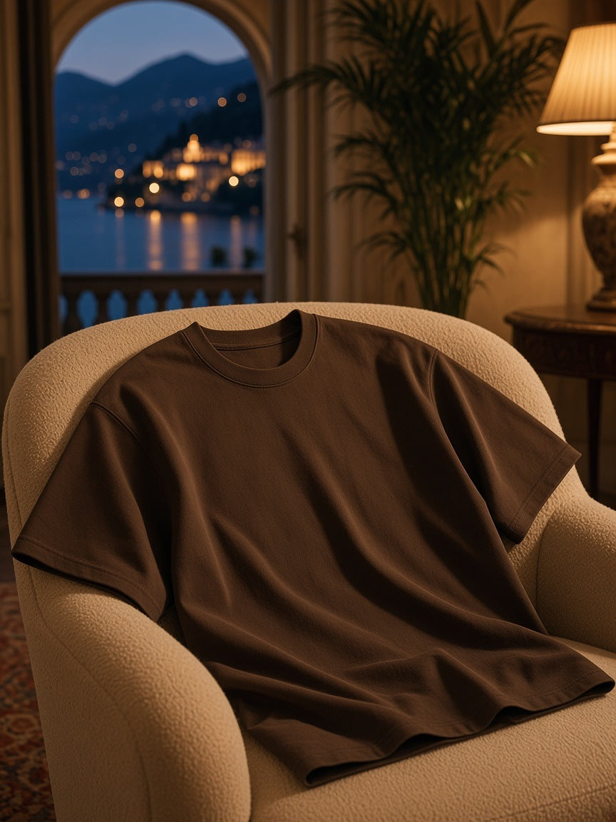 Marcel Afters Heavyweight Drop Shoulder Cotton T-Shirt in Coffee, laid flat, living room