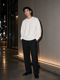 Marcel Afters Heavyweight Drop Shoulder Sweatshirt in White, worn by a man, city