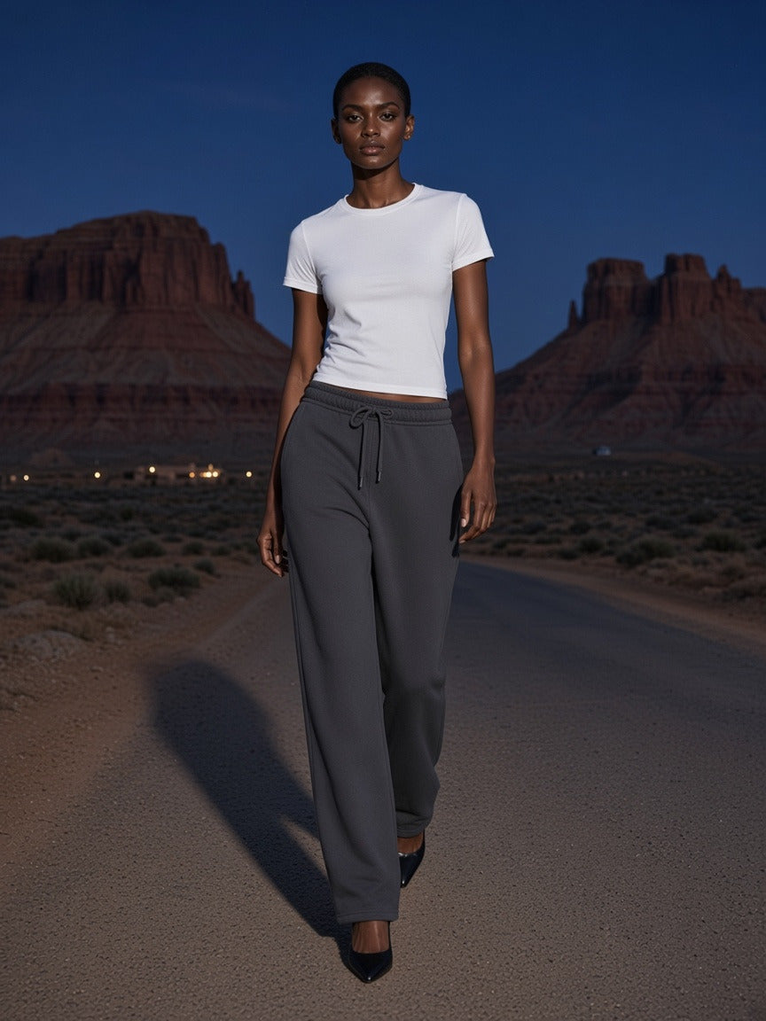 Woman wearing the Heavyweight Fleece Sweatpants in Dark Gray, full-length model photo