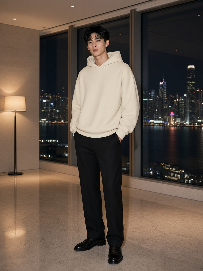 Marcel Afters Heavyweight Hidden Pocket Fleece Hoodie in Bone, worn by a man, city at night