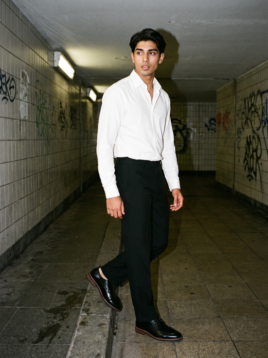 Friends together, one wearing the Marcel Afters Heavyweight Straight-Leg Trousers in Black
