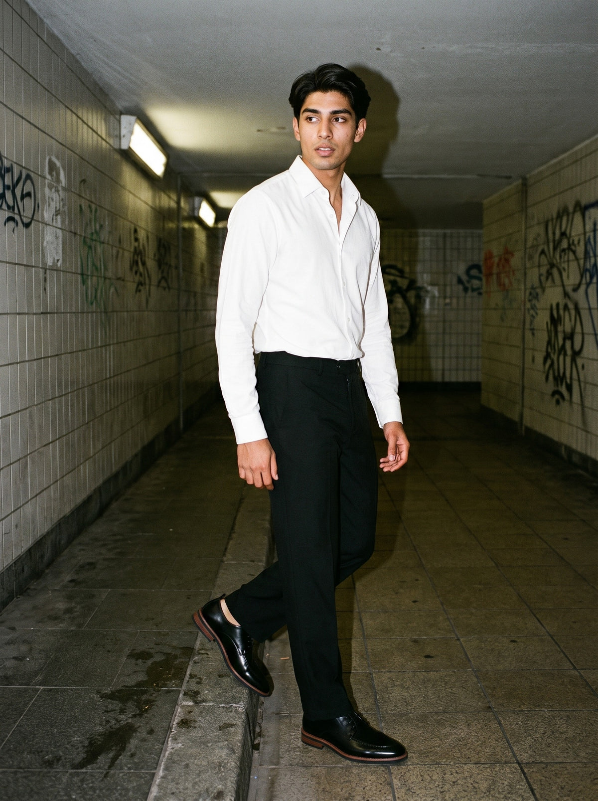 Friends together, one wearing the Marcel Afters Heavyweight Straight-Leg Trousers in Black