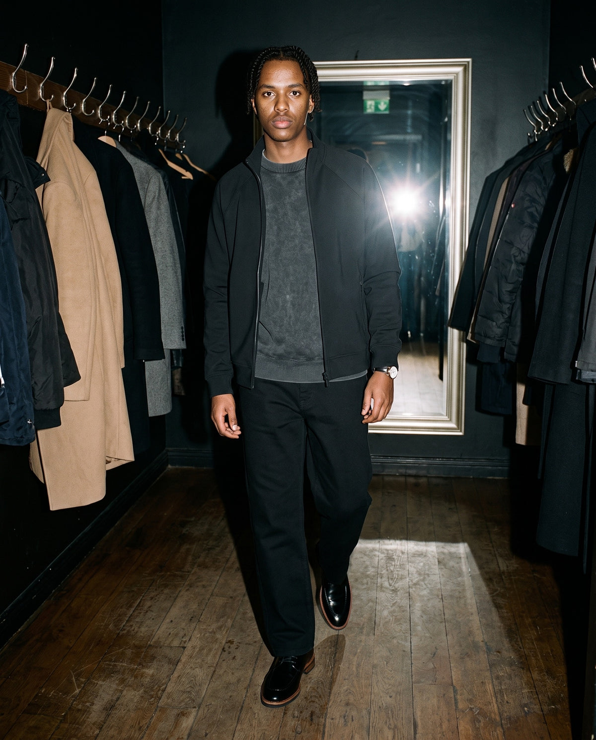 Man wearing the Marcel Afters Heavyweight Straight-Leg Trousers in Black, full-length editorial photograph