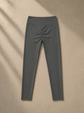 Women's High Waisted Ankle Leggings in Dark Gray, laid flat on pale limestone, back view