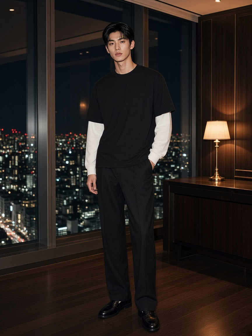 Marcel Afters Layered Contrast Sleeve Cotton T-Shirt in Black, worn by a man, city at night