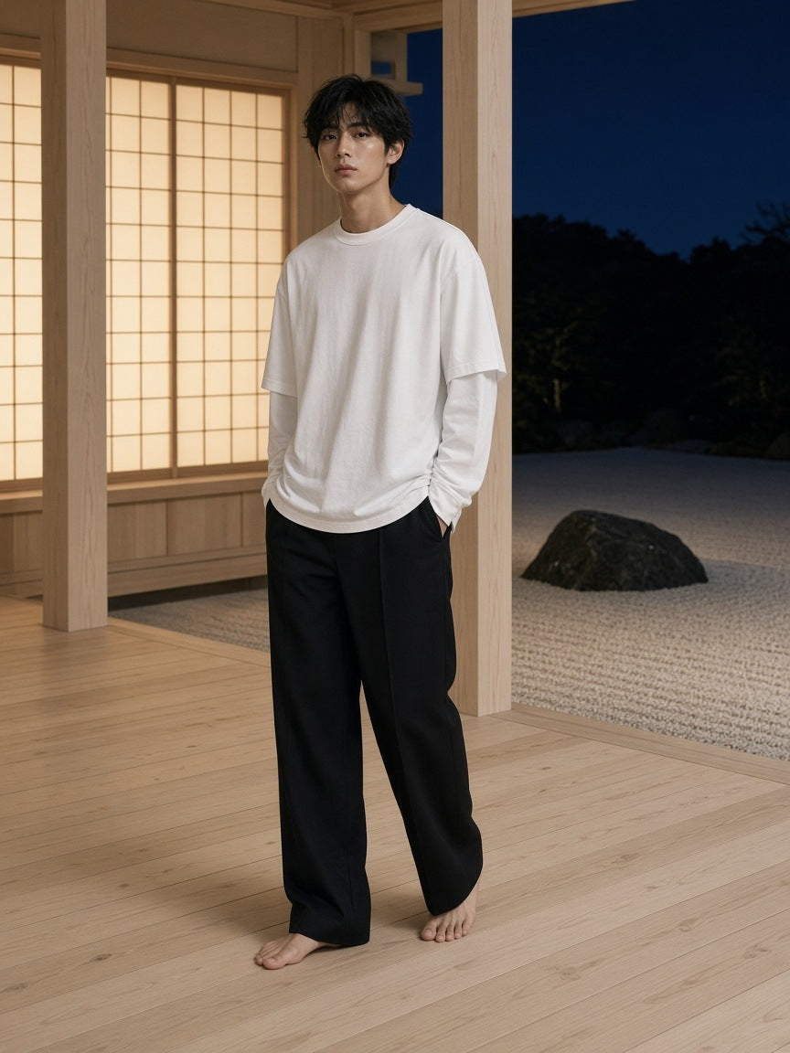 Marcel Afters Layered Oversized T-Shirt in White, worn by a man, wooden room